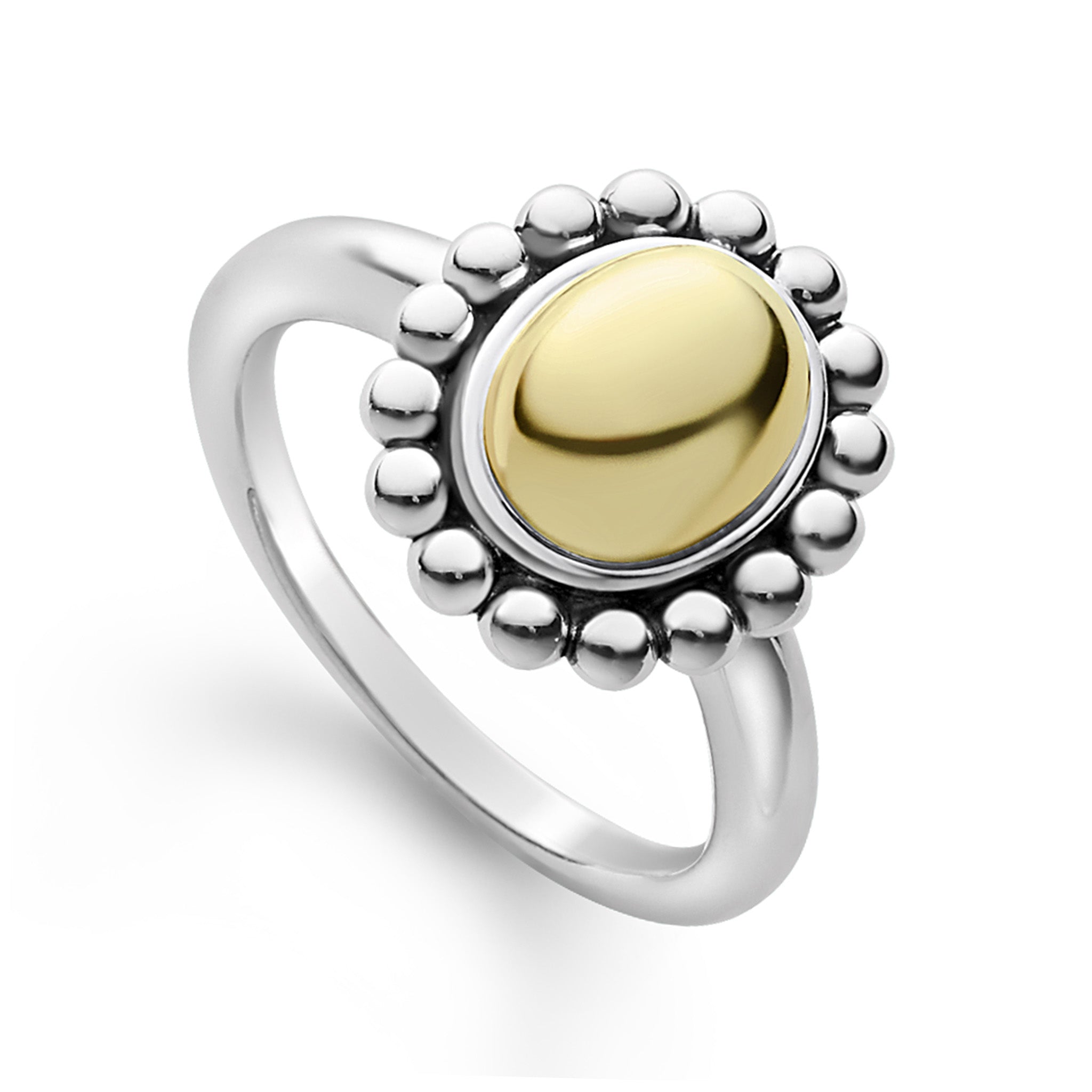 Smooth 18k gold oval dome set by sterling silver Caviar beading forms this ring.