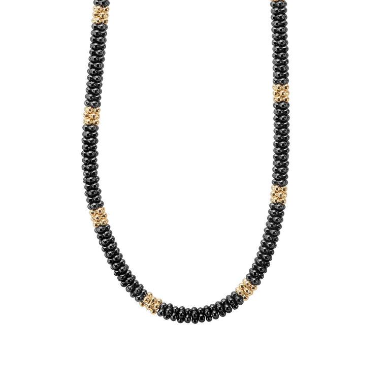 Twelve small 18K gold stations highlighted by black ceramic Caviar beading on this necklace finished with an 18K gold lobster clasp.