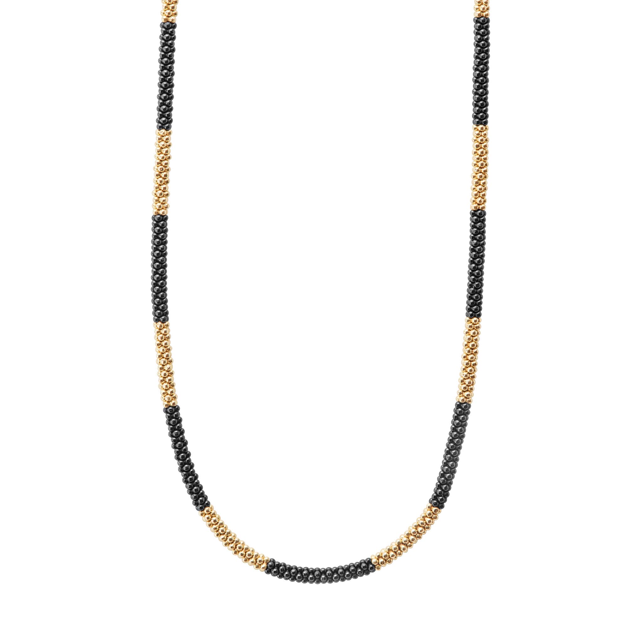 Ten 18K gold stations highlighted by black ceramic Caviar beading on this necklace finished with an 18K gold lobster clasp.