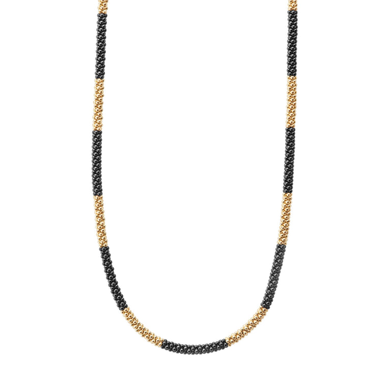 Ten 18K gold stations highlighted by black ceramic Caviar beading on this necklace finished with an 18K gold lobster clasp.