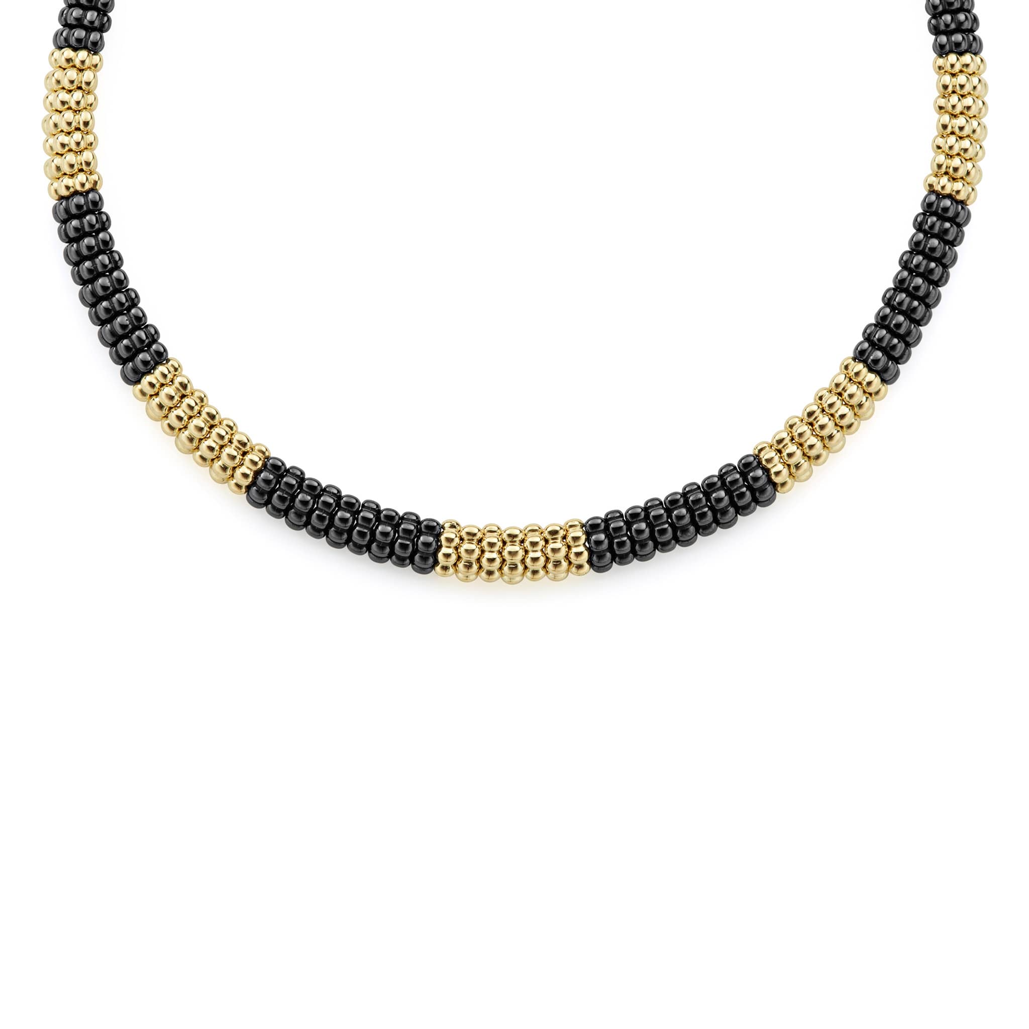 A LAGOS exclusive. Seven 18K gold stations highlighted by black ceramic Caviar beading on this necklace finished with an 18K gold box clasp.
