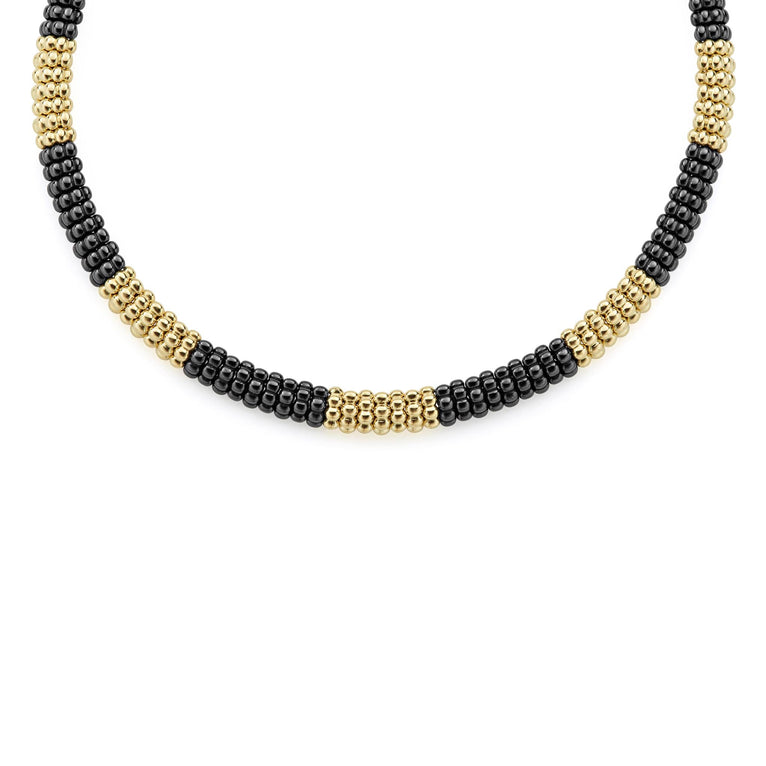 A LAGOS exclusive. Seven 18K gold stations highlighted by black ceramic Caviar beading on this necklace finished with an 18K gold box clasp.
