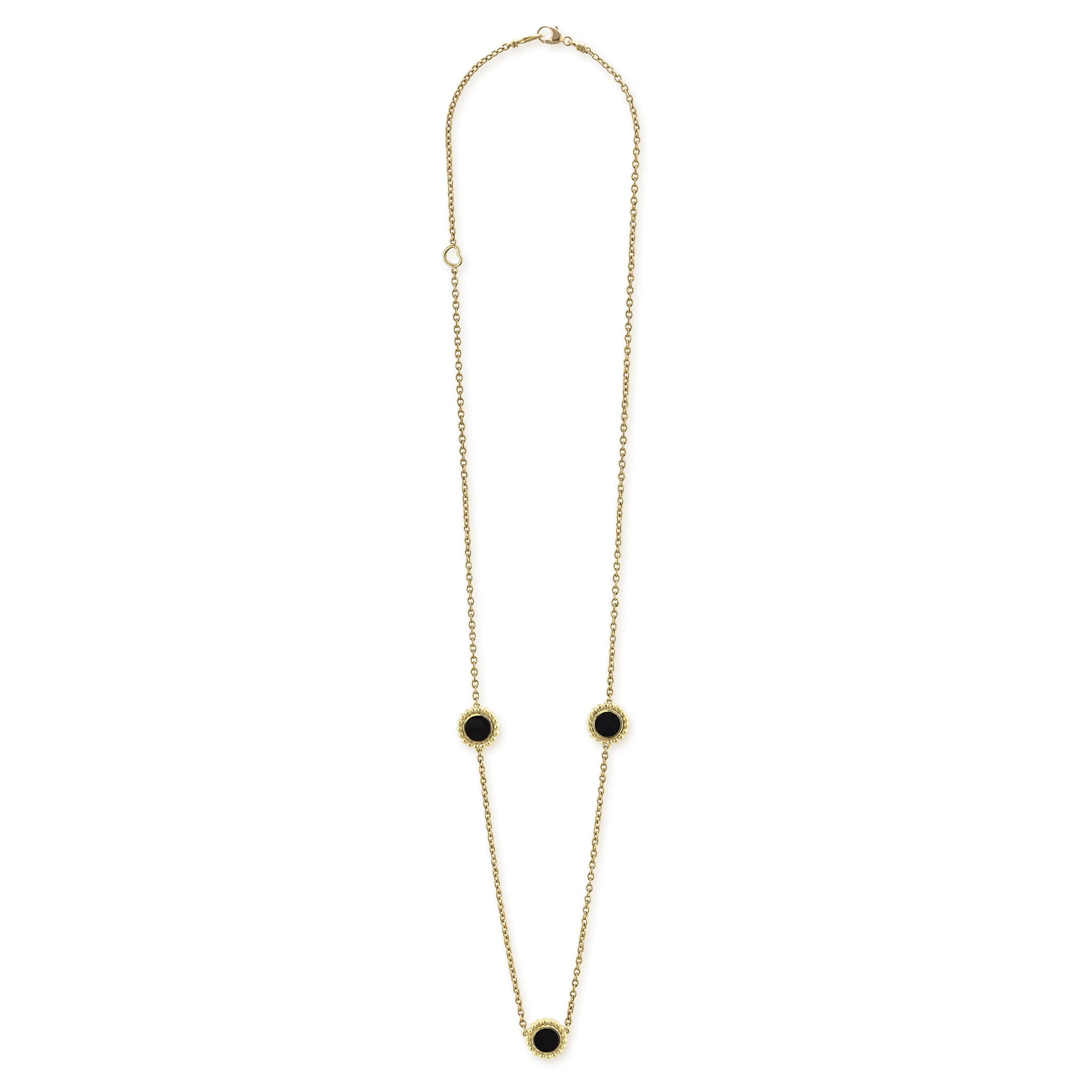 Three round onyx stations set and surrounded by 18K gold Caviar beading on this necklace.
