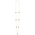 Seven round onyx stations set and surrounded by 18K gold Caviar beading on this necklace.