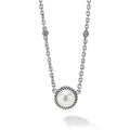 A modern necklace with a cultured freshwater pearl framed by sterling silver beading finished on a versatile link necklace with six sterling silver Caviar beaded stations.