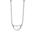 Highly polished sterling silver heart necklace with 18K gold beading. Ideal for a modern initial or classic monogram.