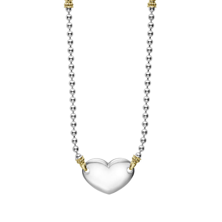 Highly polished sterling silver heart necklace with 18K gold beading. Ideal for a modern initial or classic monogram.