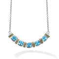 Five swiss blue topaz gemstones accent this necklace surrounded by sterling silver and 18K gold Caviar beading.