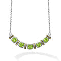 Five peridot gemstones accent this necklace surrounded by sterling silver and 18K gold Caviar beading.