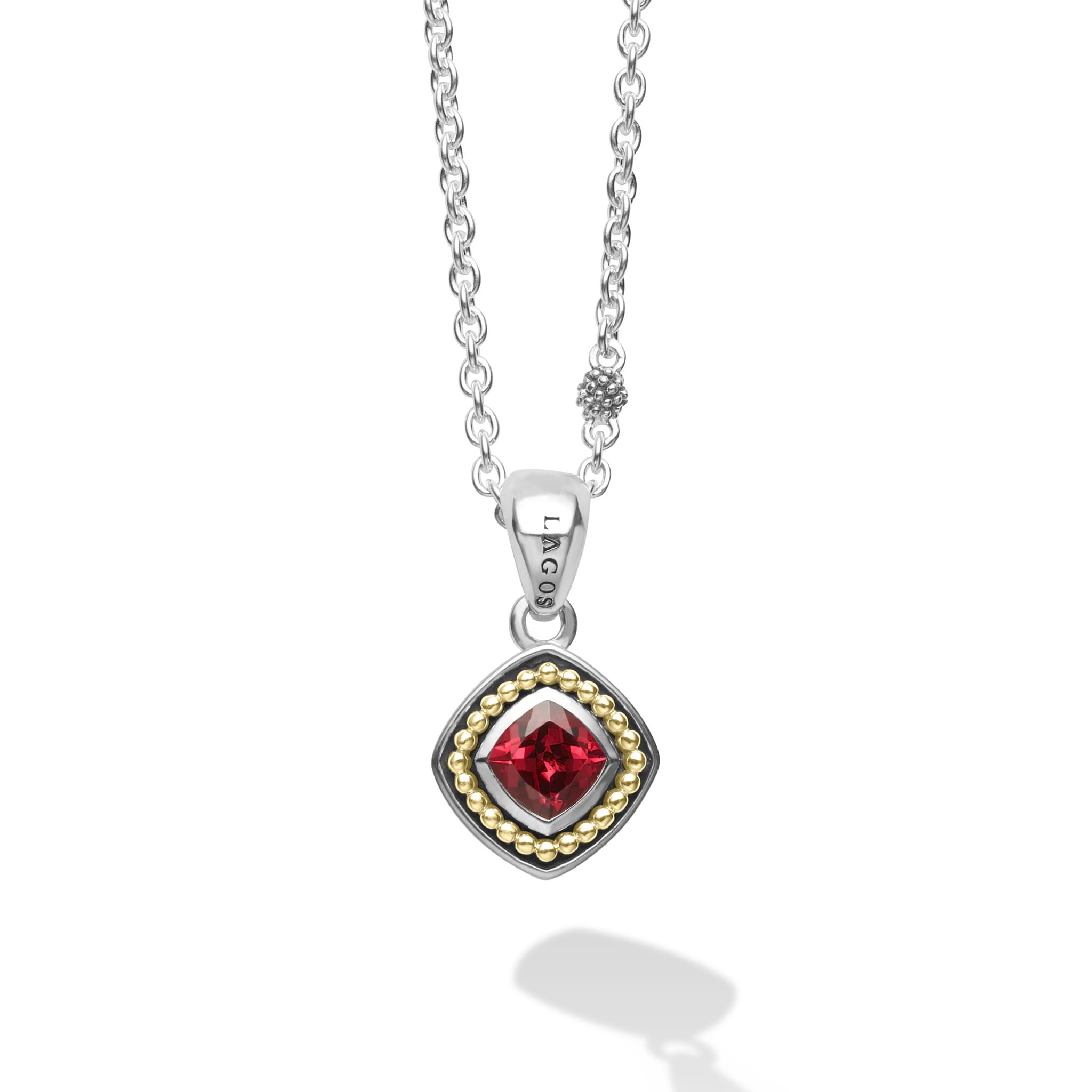 A rhodolite garnet gemstone surrounded by sterling silver and 18K gold Caviar beading form this pendant. Finished on a versatile link necklace with six sterling silver Caviar beaded stations.