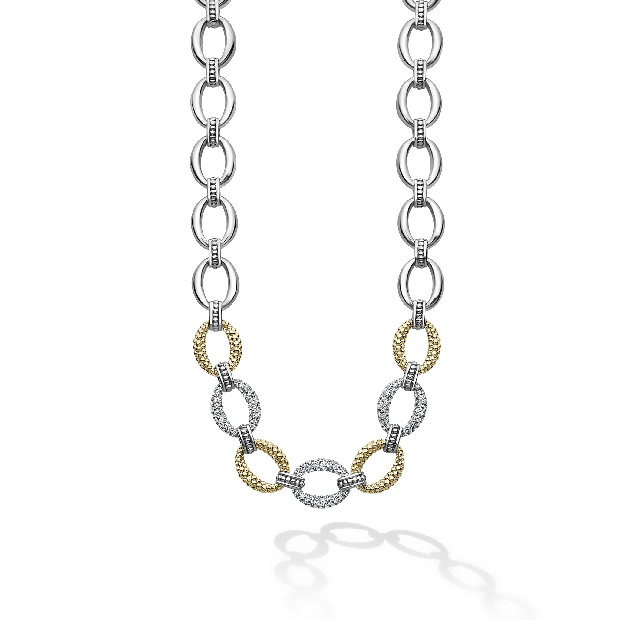 Three pavé diamond links, 18k gold and sterling silver create this classic link necklace. LAGOS diamonds are the highest quality natural stones.