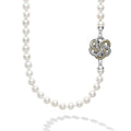 Five 18k gold and sterling silver Love Knot stations accent this necklace of cultured freshwater pearls.