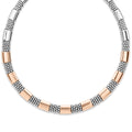 Nine smooth stations of 18K rose gold and sterling silver surrounded by Caviar beading form this necklace.