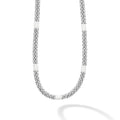 A sterling silver Caviar beaded necklace with nine white ceramic stations.
