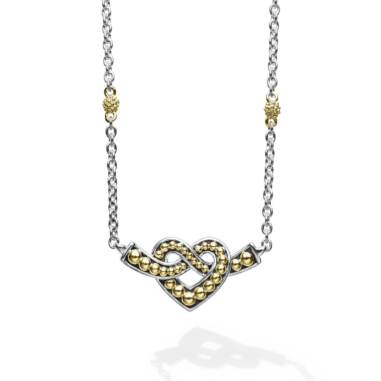 Sterling silver and 18k gold intertwine to form this unique Beloved heart finished on a versatile link necklace with six Caviar beaded stations.