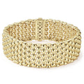 A dramatic 18k gold Caviar beaded bracelet.