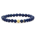 Lapis gemstone bracelet with an 18K gold Caviar beaded station that is ideal to style with various bracelets for a unique look.