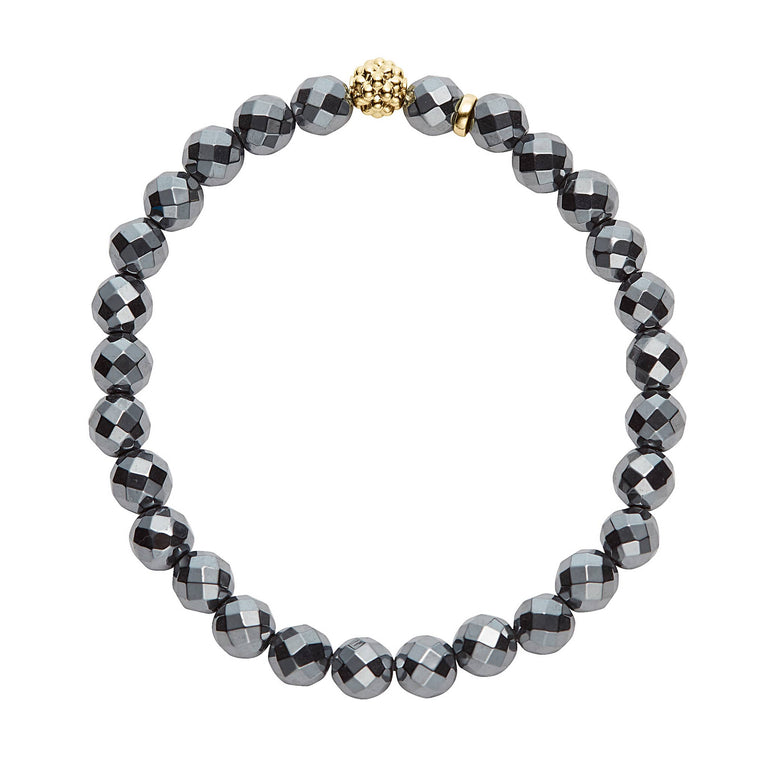 Caviar Icon Hematite Gold Station Bead Bracelet featuring faceted metallic-gray beads with a central textured gold-tone bead, exemplifying LAGOS commitment to elegant, quality craftsmanship.