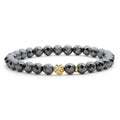 Hematite gemstone bracelet with an 18K gold Caviar beaded station that is ideal to style with various bracelets for a unique look.