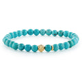 Turquoise gemstone bracelet with an 18K gold Caviar beaded station that is ideal to style with various bracelets for a unique look.