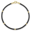 Five 18K gold stations highlighted by black ceramic Caviar beading form this signature bracelet.