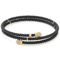 Black ceramic Caviar beading finished with 18k gold diamond endcaps forms this coil bracelet. LAGOS diamonds are the highest quality natural stones.
