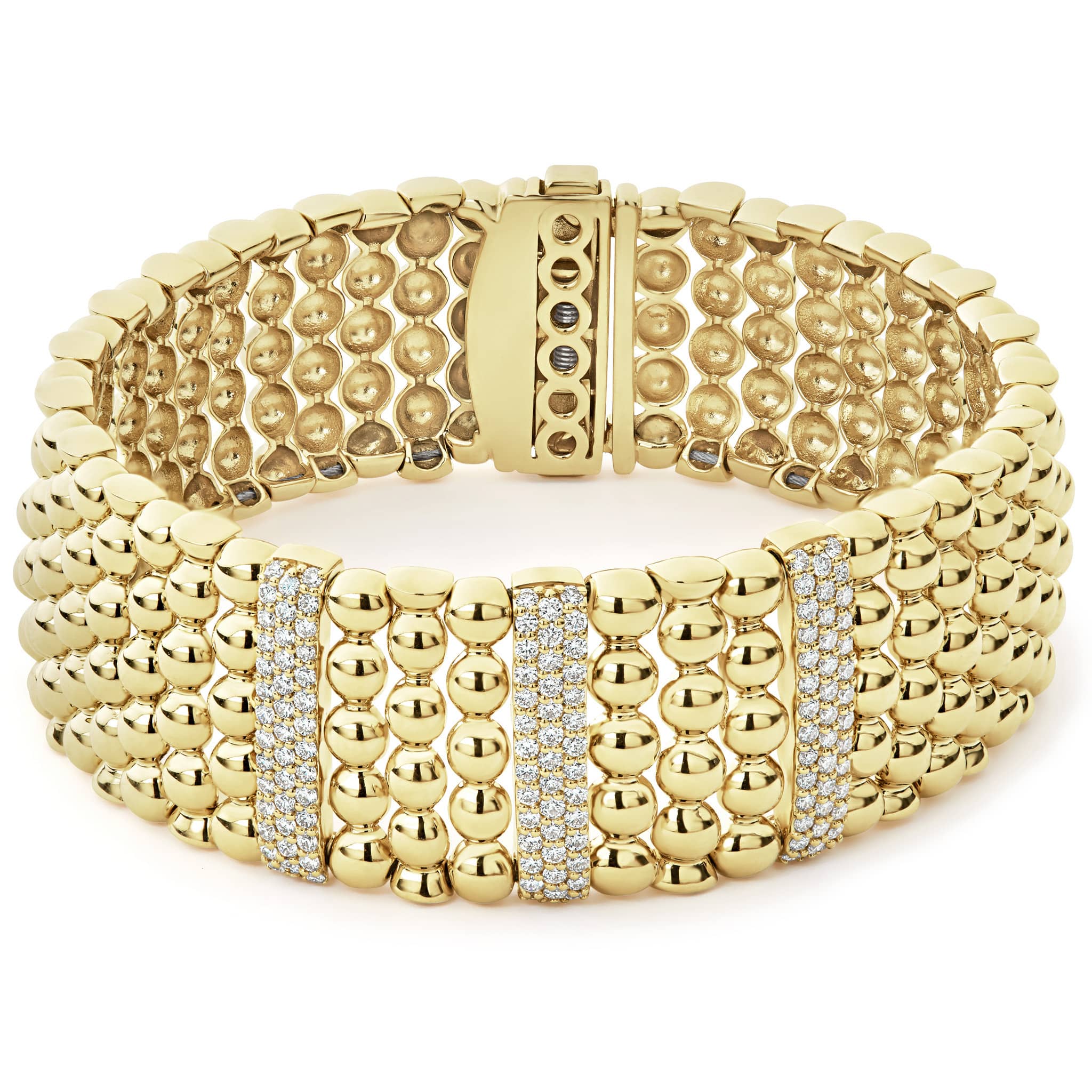 Three diamond stations highlighted by dramatic 18K gold Caviar beading form this bracelet. LAGOS diamonds are the highest quality natural stones.