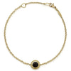 An 18k gold bracelet including an onyx inlay station with Caviar beaded details.