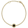An 18k gold bracelet including an onyx inlay station with Caviar beaded details.