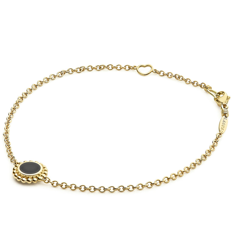 Covet Single Station Round Onyx Bracelet featuring an 18K gold chain with a black onyx charm, caviar beading, and a heart link near the clasp.