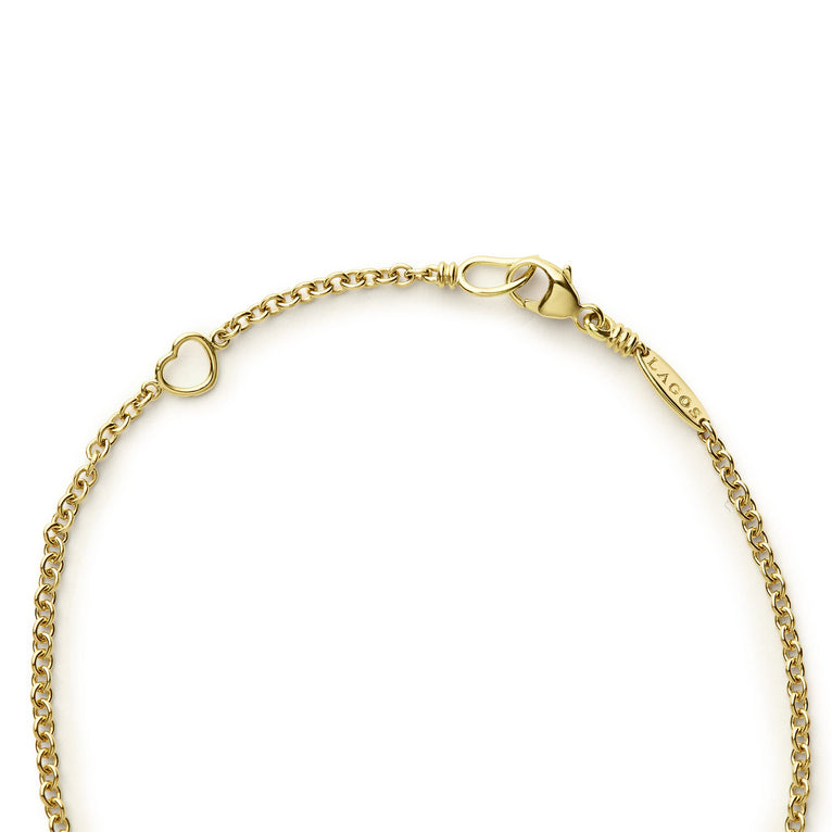 Covet Single Station Round Onyx Bracelet features a heart-shaped link, lobster-claw clasp, and LAGOS tag, crafted in 18K gold with onyx inlay and caviar beading.