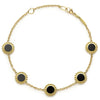 An 18k gold bracelet including five onyx inlay stations with Caviar beaded details.