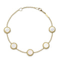 An 18k gold bracelet including five Mother of Pearl inlay stations with Caviar beaded details.