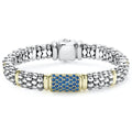 Ten 18K gold stations highlight this sterling silver Caviar beaded bracelet with a pavé station of blue sapphire gemstones.