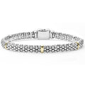 Five 18k gold stations with sterling silver Caviar beading form this signature bracelet.