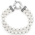 A timeless piece created from a double strand of freshwater cultured pearls and sterling silver beaded stations.