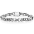 Diamonds set in sterling silver are framed by a buckle on this signature Caviar beaded bracelet. LAGOS diamonds are the highest quality natural stones.