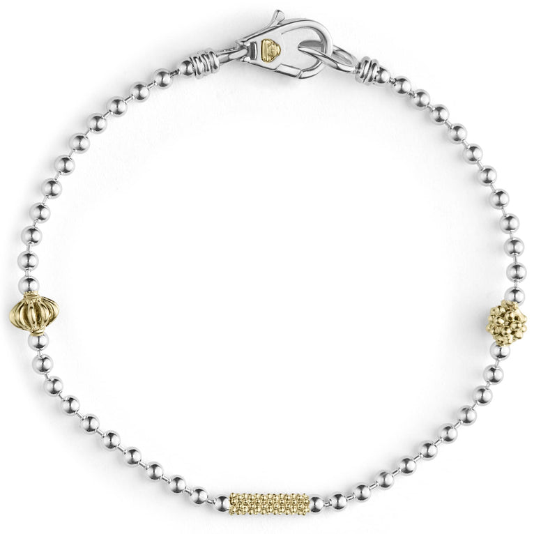 A sterling silver bracelet with 18K gold Caviar beading and fluted accents.