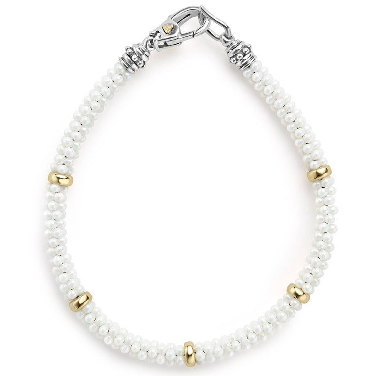 A white ceramic Caviar bracelet accented by five 18K gold stations.