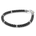 Black Caviar Black Five Silver Station Ceramic Bracelet features glossy black beads with silver spacer rings and clasp, embodying LAGOS elegance and contemporary design.