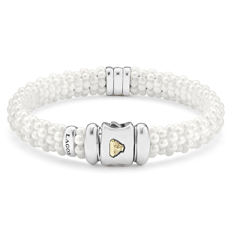 White Caviar Single Station Ceramic Diamond Bracelet 9mm features multi-strand white ceramic beads, a sterling silver clasp with gold emblem, and a diamond-accented silver station.
