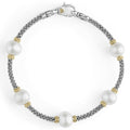 Five cultured freshwater pearl stations with Caviar beading in 18K gold and sterling silver form this classic bracelet.
