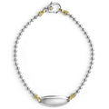 A highly polished sterling silver bracelet with 18K gold beading, ideal for a modern initial or classic monogram.