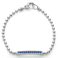A linear blue sapphire gemstone station set by sterling silver Caviar beading forms this bracelet.