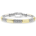 Smart Caviar 18K Gold Gift Set features a two-tone beaded bracelet with textured clusters and polished bars in silver and gold, showcasing LAGOS’ signature craftsmanship.