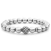 A highly polished sterling silver bracelet with a Caviar beaded accent.