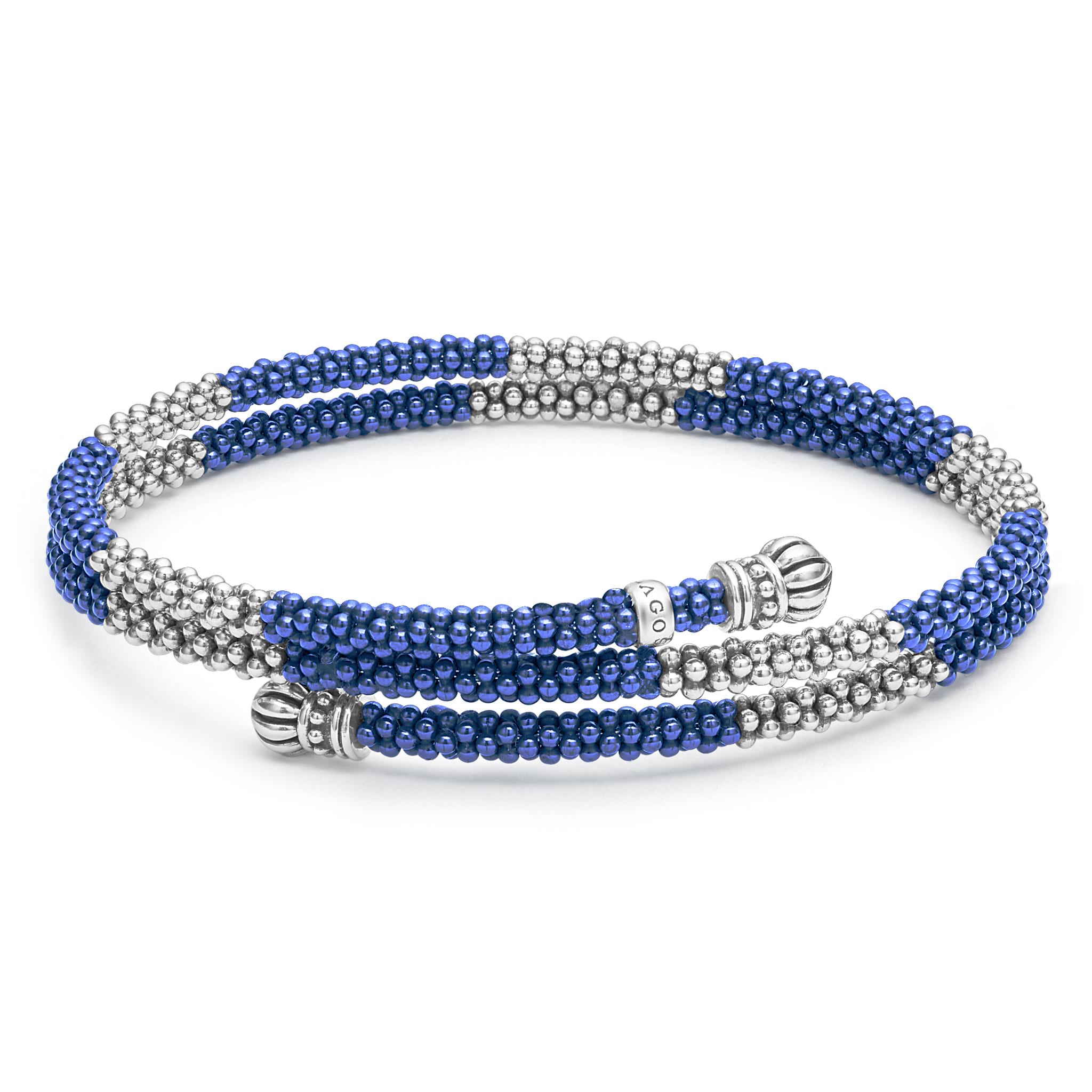 Ten sterling silver stations highlighted by ultramarine ceramic Caviar beading finished with fluted sterling silver endcaps form this coil bracelet.