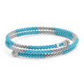 Ten sterling silver stations highlighted by blue ceramic Caviar beading finished with fluted sterling silver endcaps form this coil bracelet.