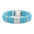 Sleek sterling silver stations and blue ceramic Caviar beading form this statement bracelet.