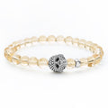 Citrine gemstone beaded bracelet with a sterling silver Caviar skull.